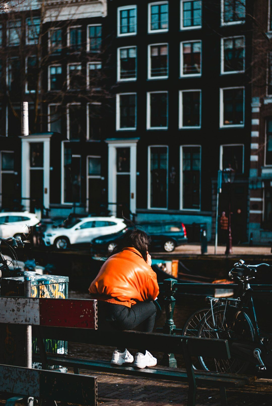 Dutch male crime novelist sitting at a desk with books